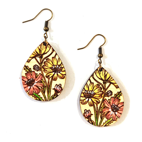 A pair of teardrop-shaped dangle earrings with a vintage floral print featuring yellow and pink flowers on a cream background, suspended from bronze-colored fishhook wires.