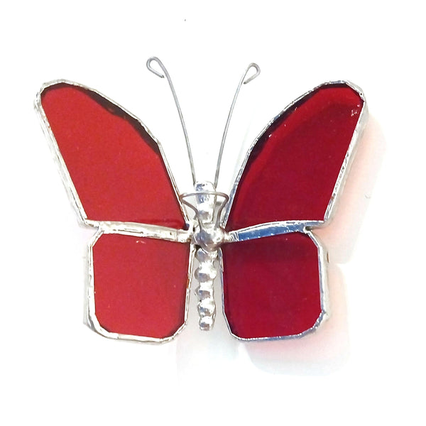 A butterfly-shaped hanging suncatcher featuring red stained glass wings and a silver metal body and antennae.