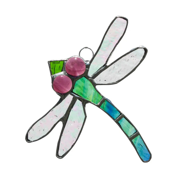 Stained glass dragonfly in peacock blue with pink eyes.