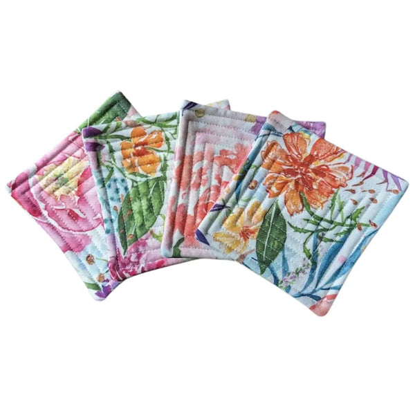 Quilted fabric coaster set with multi-color floral pattern.