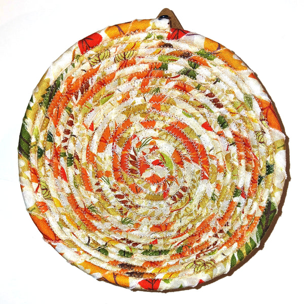 Fabric bowl in orange and green colors.