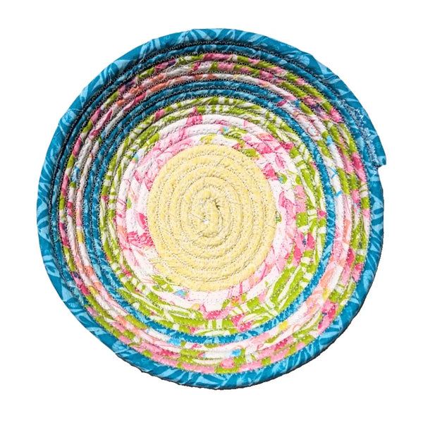 Fabric bowl with mixed prints in multiple colors.
