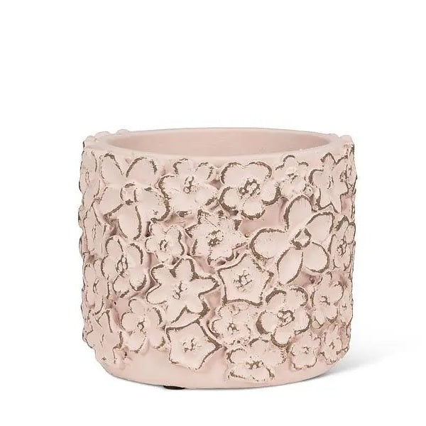 Round cement planter with pink sculpted flowers
