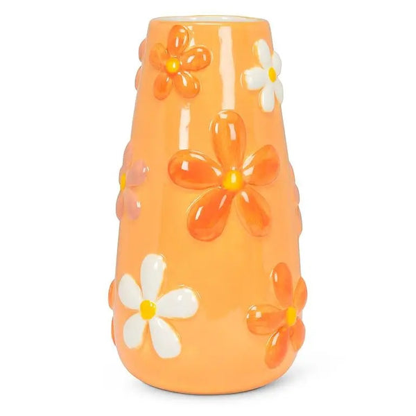 Tall melon orange ceramic vase with sculpted flower design in orange and white.