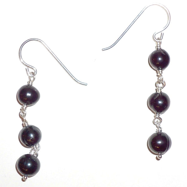 Sterling silver French wires with sterling metal and black onyx drops, available at Cerulean Arts.