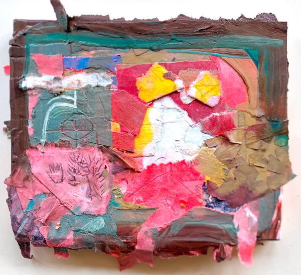 Collage art piece with colorful textured materials on a white background