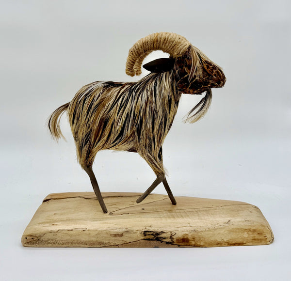 Decorative ram sculpture on a wooden base 