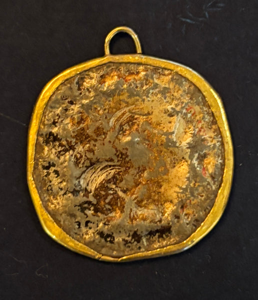 Bottle cap set in 22 kt and 18 kt gold pendant by artist Jessica Berwind. Included in the exhibition, REUNION (Once Upon a Time in Philadelphia), at Cerulean Arts February 26 - March 24, 2025.