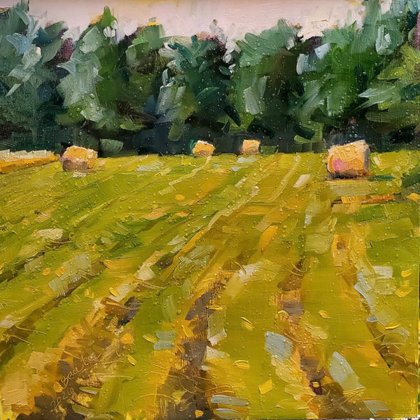 Impressionistic oil painting of a harvested field with golden-yellow rows, scattered hay bales, and a dark green tree line under a pale sky.