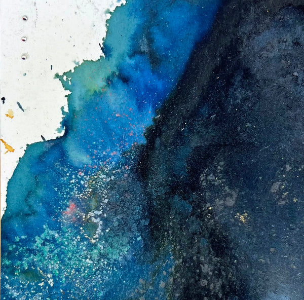 Abstract art with blue and black colors on a textured surface