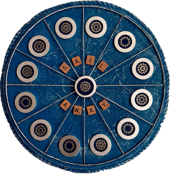 Blue wheel with wooden letters spelling 'SAIL AWAY'