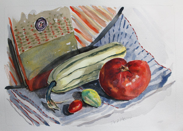 Still life with delicata squash, tomato, and small fruit on a striped fabric background