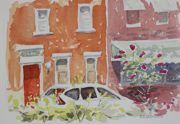 White Car with Red Bush, watercolor on paper cityscape painting by Cerulean Arts Collective Member Susan K. D'Alessio.