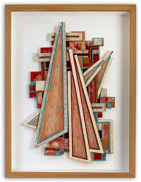 Abstract framed wall art featuring layered geometric shapes and woodgrain-textured panels in red, orange, beige, and blue tones, enclosed in a light wood frame with white matting.