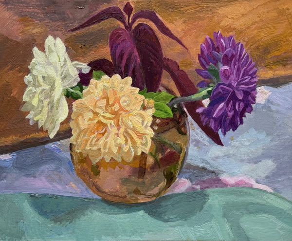 A still life oil painting of three flowers in a reflective glass vase, featuring a white carnation, a pale yellow chrysanthemum, and a purple flower, set against a warm brown background and a teal table surface.
