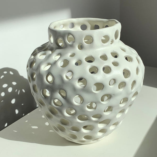 Holey Vase, porcelain sculpture by artist Julie Jung.  Included in the exhibition, REUNION (Once Upon a Time in Philadelphia), at Cerulean Arts February 26 - March 24, 2025