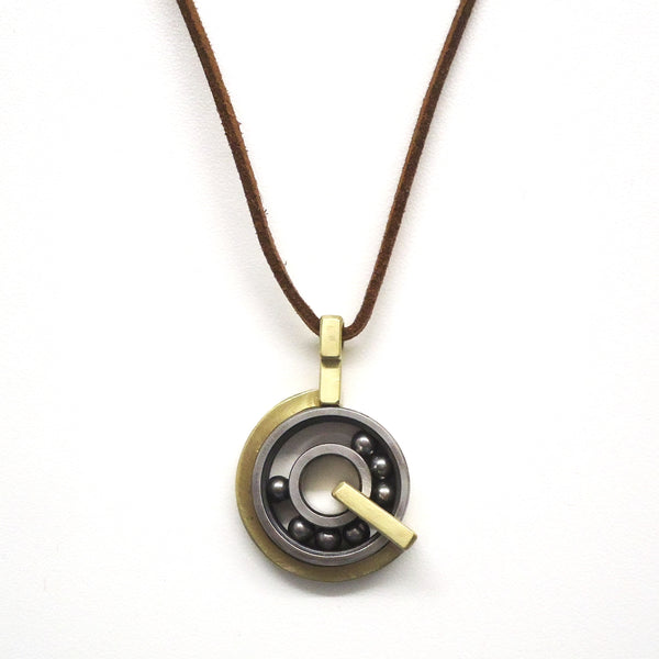 Brass and steel pendant handmade by Philadelphia artist Kathleen Studebaker, available at Cerulean Arts.  