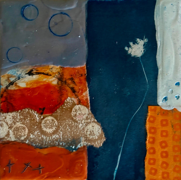 Abstract mixed media collage with orange, blue, and white elements on a textured surface