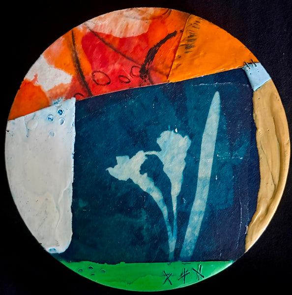 Artistic depiction of flowers on a circular mixed media collage with colorful abstract elements
