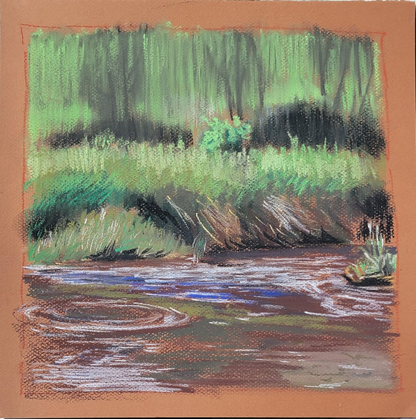 A pastel landscape painting of a stream with rippling water in the foreground, grassy banks, and a dense green tree line in the background, framed by a warm terracotta border.