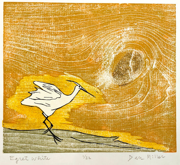 Woodcut print of an egret against a textured yellow and brown background with a signature at the bottom right corner.