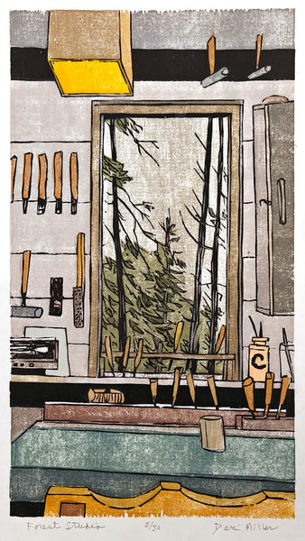 Woodcut print of an artist's studio with wood carving tools and trees visible through a window