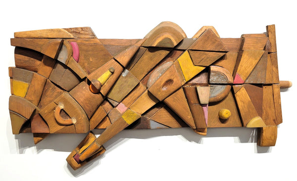 Wooden abstract sculpture with geometric shapes on a white background
