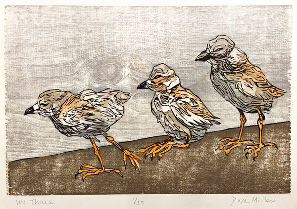 Woodcut print of three birds standing on a ledge with a textured background