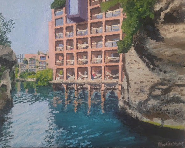 Painting of a building reflected in water with greenery around