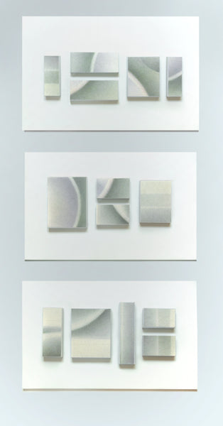 Set of three abstract wall art pieces on a light gray background