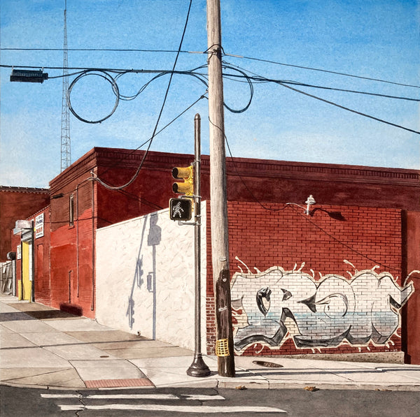 Watercolor painting a street corner with brick buildings and graffiti.
