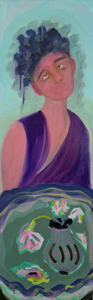 Artistic portrait of a person wearing purple with a vase with flowers in the foreground
