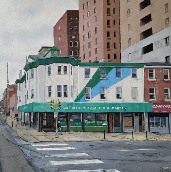 City street scene with a building featuring a colorful geometric design and 'Green Village Food Market' sign.