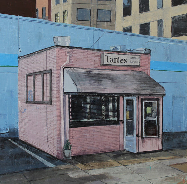 Pink building with 'Tartes' sign against a blue wall