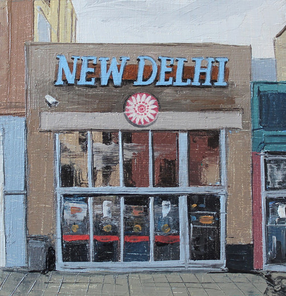 Painted image of a building facade with 'New Delhi' sign and window display.