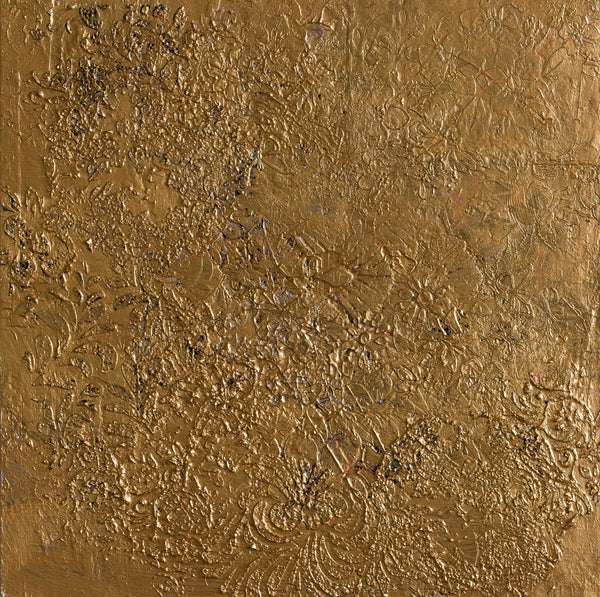 Textured gold surface with intricate patterns