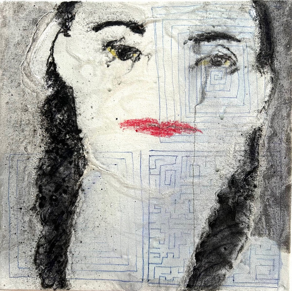 Abstract art piece with a face-like design on a textured background