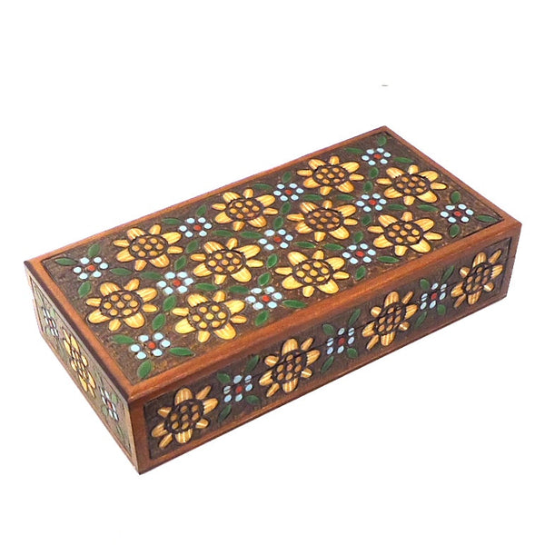 Carved wood box with floral motif.