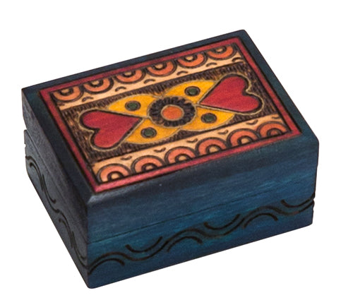 Blue stained carved wood box with heart design on lid.
