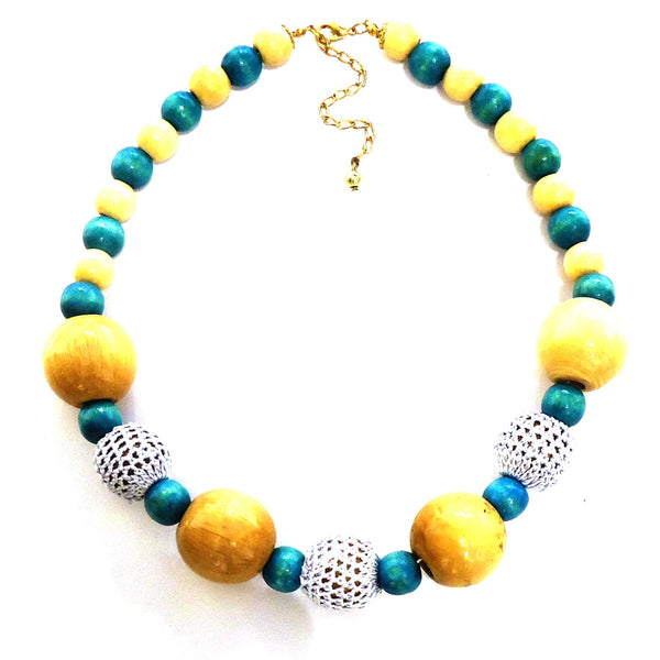 Natural and blue stained wood bead necklace featuring crochet detail, available at Cerulean Arts.