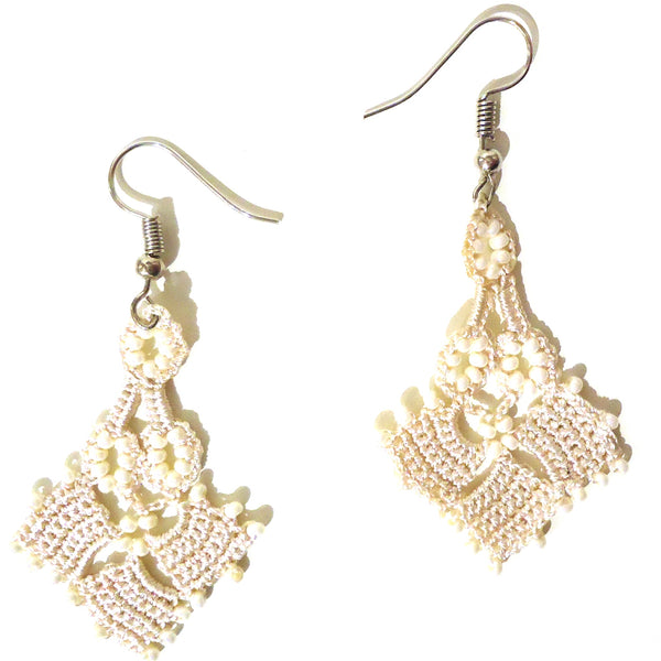 Cream colored silk crochet and seed bead earrings available at Cerulean Arts. 