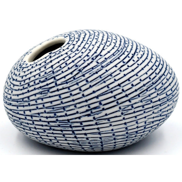 Pebble-shaped porcelain bud vase with blue pattern design, available at Cerulean Arts. 