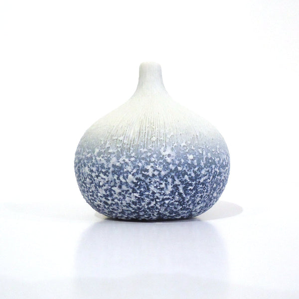 Gourd-shaped porcelain bud vase with rough frosted texture in blue fading to white available at Cerulean Arts. 