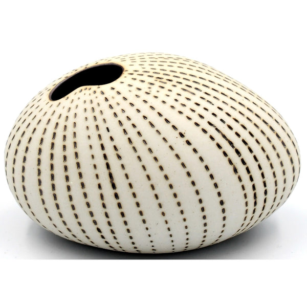 Pebble-shaped porcelain bud vase with stippled brown stripes available at Cerulean Arts.  Handmade in Thailand. 
