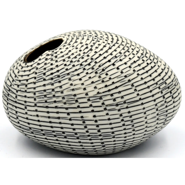 Pebble-shaped porcelain bud vase with black pattern design, available at Cerulean Arts. 