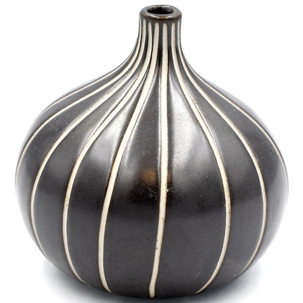 Gourd-shaped porcelain bud vase in shiny black with white ribbed design available at Cerulean Arts. 