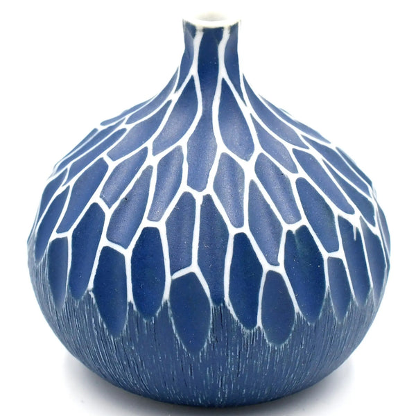 Gourd shaped porcelain bud vase with geometric texture in deep blue and white available at Cerulean Arts.  