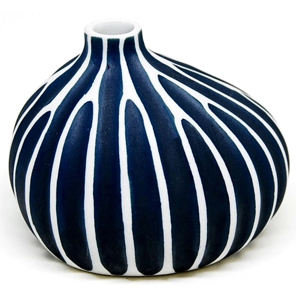 Asymmetrical porcelain bud vase in deep blue with carved white stripes available at Cerulean Arts.  