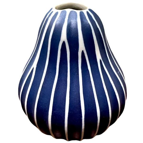 Pear-shaped porcelain bud vase with ribbed design in navy blue available at Cerulean Arts.  Handmade in Thailand.  H 3 1/4" x W 2 3/4"