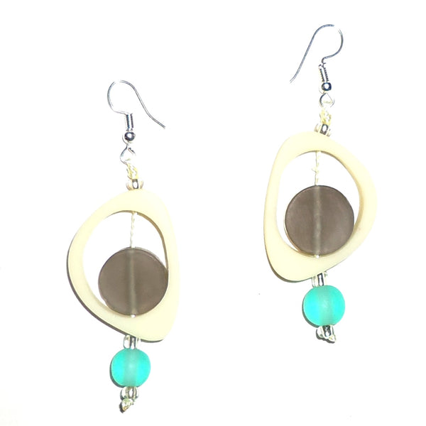 Bold cream ovoid resin earrings with gray circles, accented with sea green beads available at Cerulean Arts.  